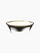 The Olfacte Chapter Statement Candle in a wide, dark, translucent glass bowl, showing four wicks in the off-white wax.