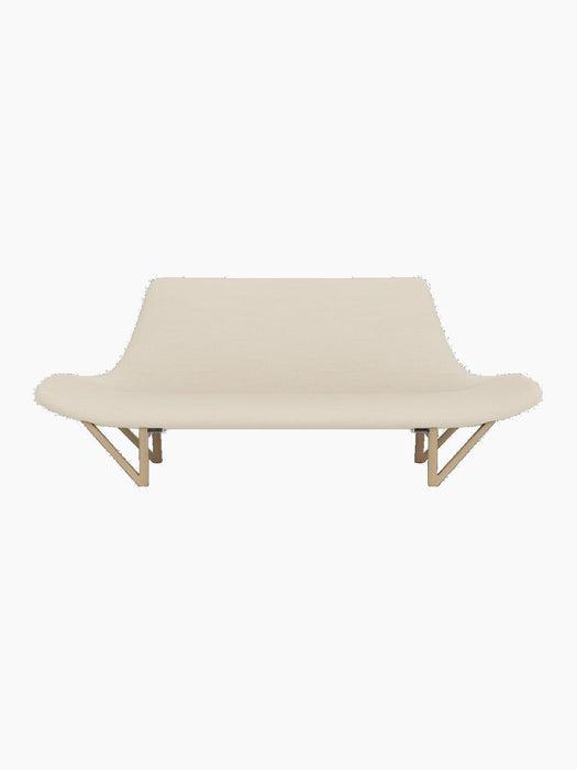 A front-on view of the Pagode Sofa with light cream Hallingdal 200 upholstery and a natural oak frame with V-shaped legs.