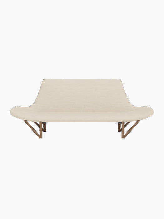 Front view of the Pagode Sofa, upholstered in light cream Hallingdal fabric with a sculptural frame and V-shaped walnut legs.