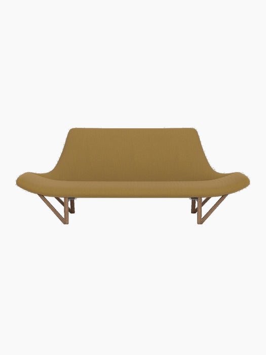 The Pagode Sofa, viewed from the front. It has yellow Re-Wool upholstery, low curved armrests, and V-shaped walnut legs.