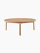 Front view of the Passage Lounge Table in natural oak. The low, round table has a solid wood top and three sturdy legs.