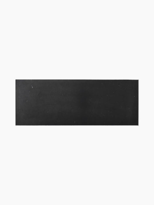 A top view of the Plinth Bridge Nero Marquina marble slab, showing its rectangular shape and dark, veined surface texture.