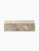 Front view of the Plinth Low, a rectangular podium in textural Kunis Breccia stone with beige and grey patterns.
