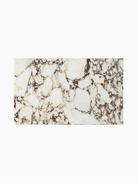 Top-down view of the Plinth Low table, showcasing the white surface and deep purple veining of the Calacatta Viola marble.