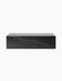 Front view of the Plinth Low, a long rectangular podium made of black Nero Marquina marble with distinctive white veining.