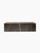 A rectangular Plinth Low table made from brown-grey marble with striking white veins, isolated on a black background.