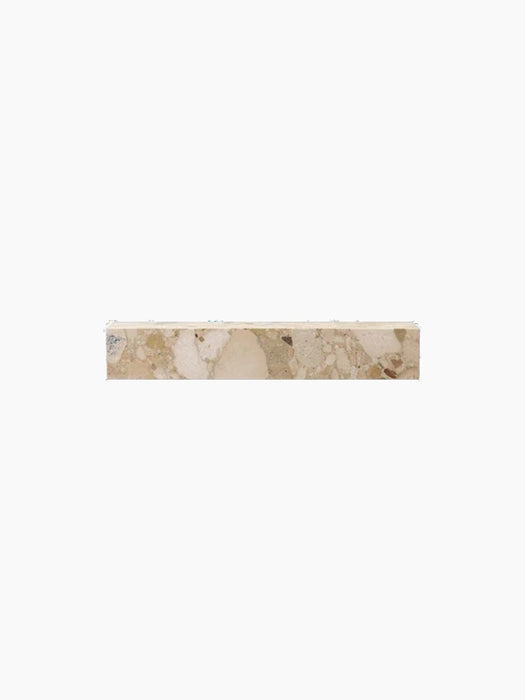 A front view of the rectangular Plinth Shelf in Kunis Breccia marble, showing its composite pattern of earthy tones.