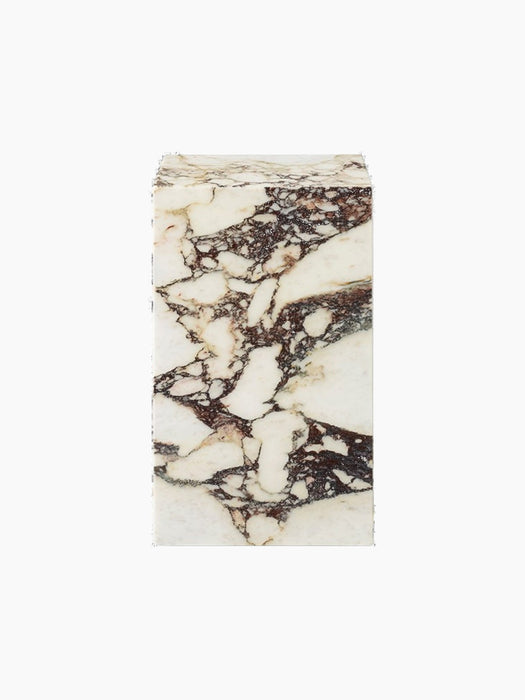 Front view of the Plinth Tall in Rose, a rectangular pedestal crafted from marble with dramatic, fragmented deep-red veining.