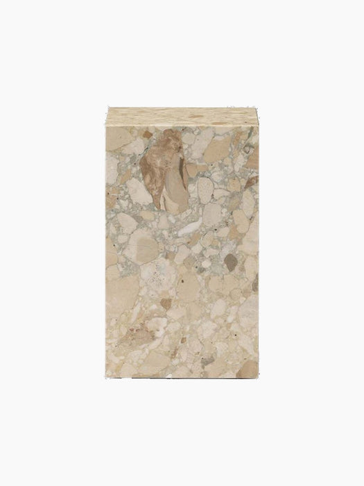 A side view of the rectangular Plinth Tall in Kunis Breccia marble, which features a mix of beige, cream, and grey fragments.