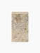 A side view of the rectangular Plinth Tall in Kunis Breccia marble, which features a mix of beige, cream, and grey fragments.