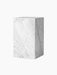 A tall, rectangular Plinth in white marble with soft grey veining, shown from an angled perspective on a black background.