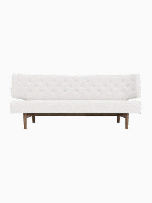 Front view of the Radiohus Sofa P2, featuring off-white button-tufted upholstery and a dark walnut wood frame.