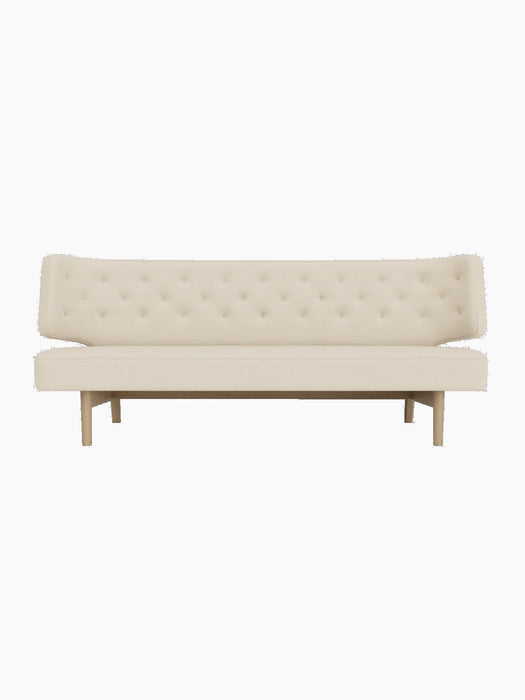 Front view of the Radiohus Sofa P2, featuring a button-tufted backrest, light Hallingdal upholstery and natural oak legs.