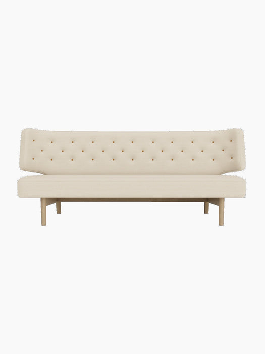 Front view of the Radiohus Sofa P2 upholstered in Hallingdal 200 fabric with Dakar leather buttons, on a natural oak frame.
