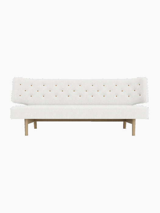 Front view of the Radiohus Sofa P2 with a natural oak frame, upholstered in light Hallingdal 110 with Dakar leather buttons.