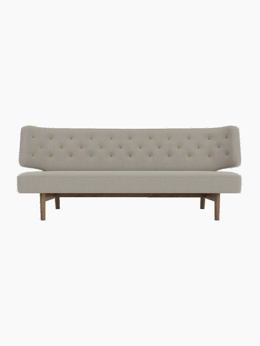 Front view of the Radiohus Sofa P2 with a walnut frame, light grey Re-Wool upholstery and brown Dakar leather buttons.
