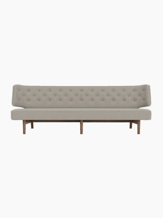 Front view of the Radiohus Sofa P3 with light grey Re-Wool upholstery, tan Dakar leather buttons and a dark walnut frame.