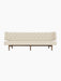 Front view of the Radiohus Sofa P3 with a walnut frame, cream upholstery and a tufted backrest with brown leather buttons.