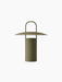Ray Table Lamp, Portable, in dusty green, with a cylindrical base, wide, flat shade and a handle on top.