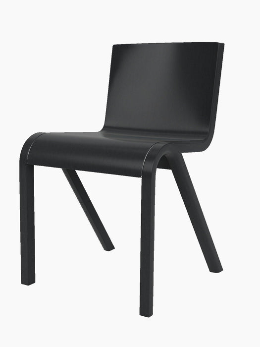 A three-quarter view of the Ready Dining Chair in black painted oak, showcasing its minimalist, cantilevered design.
