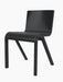 A three-quarter view of the Ready Dining Chair in black painted oak, showcasing its minimalist, cantilevered design.