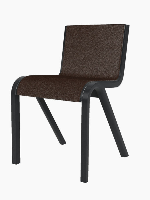 Three-quarter view of the Ready Dining Chair, Front Upholstered, with a black oak frame and dark brown Hallingdal 65 fabric