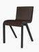 Three-quarter view of the Ready Dining Chair, Front Upholstered, with a black oak frame and dark brown Hallingdal 65 fabric