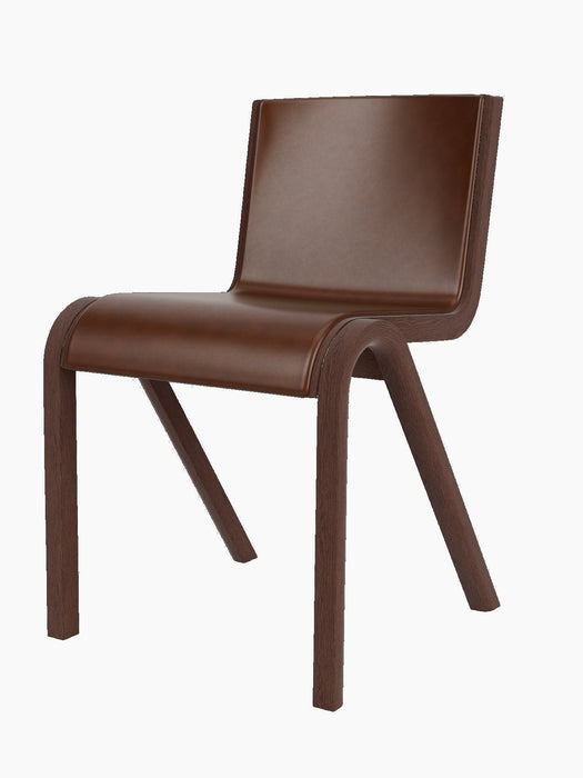 Ready Dining Chair with a red-stained oak frame and cantilevered seat and back upholstered in brown leather.