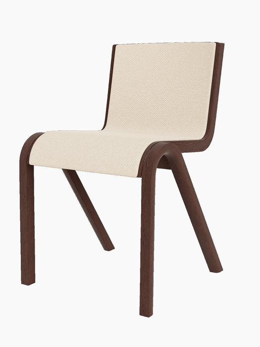A three-quarter view of the Ready Dining Chair, featuring a red stained oak frame and a seat upholstered in Logan Jasmine.