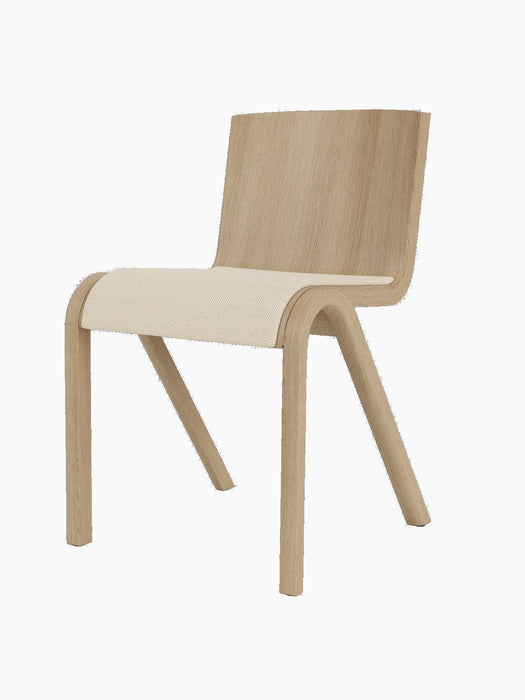 The Ready Dining Chair, featuring a natural oak frame, cantilevered design and a light-coloured Hallingdal upholstered seat.