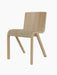 Ready Dining Chair with a natural oak frame and a seat upholstered in light Audo Bouclé fabric, from a three-quarter angle.