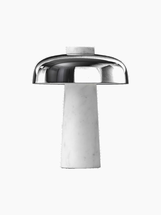 The Reverse Table Lamp has a tapered white marble base, a glossy black dome shade, and a marble top detail.