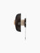 Side profile of the Reverse Wall Lamp, unlit, with a textured travertine base and smooth bronzed aluminium shade.