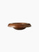 Front-facing view of the sculptural Rond Bowl, crafted from warm-toned wood, with a wide, flared rim on a dark background.