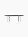 A front view of the minimalist Snaregade Oval Table in black veneer with its sleek oval top and intricate steel leg frame.