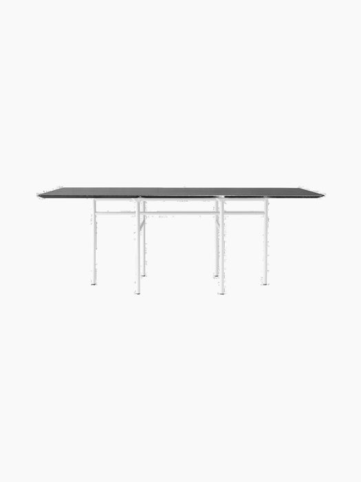 A side view of the rectangular Snaregade Dining Table. It has a black oak veneer top and a geometric light grey steel base.