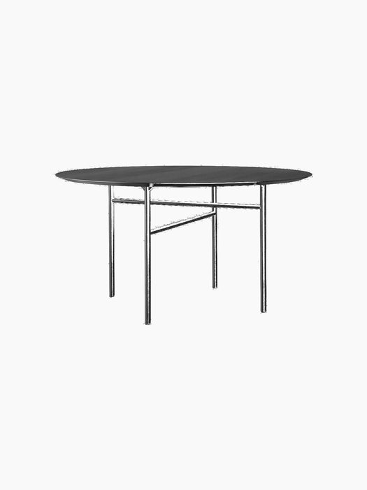 The Snaregade Dining Table, Round, shown in black with a black oak veneer top and a slender powder-coated steel frame.