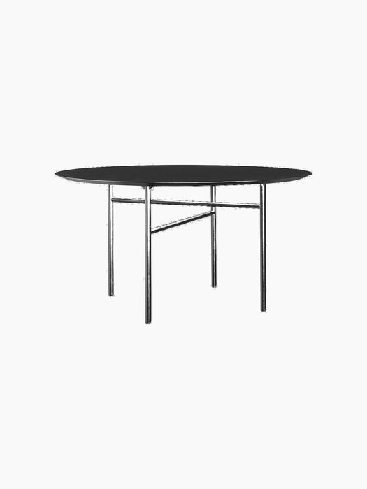 A black, round Snaregade Dining Table with a minimalist design, featuring a thin top and a geometric base of slender legs.