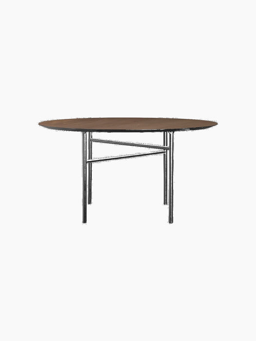 Front view of the Snaregade Dining Table, Round, with a dark stained oak top and a complex, geometric black steel base.