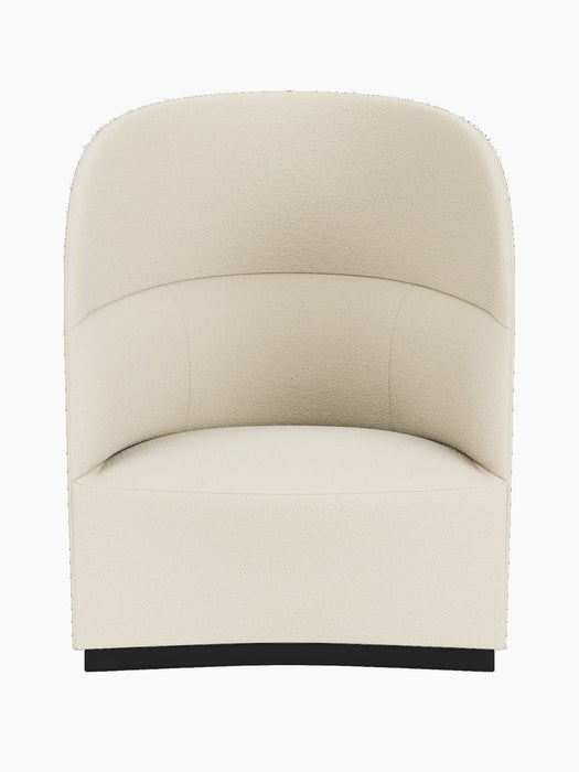 Front-on photograph of the Tearoom Lounge Chair, High Back, featuring a high, enveloping backrest in creamy textured fabric.