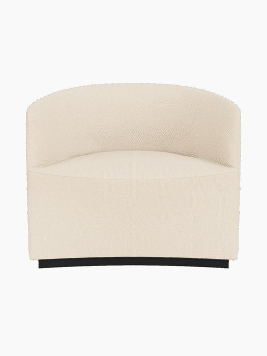 Front view of the Tearoom Lounge Chair upholstered in Logan Jasmine, a textured cream fabric, on a recessed dark base.