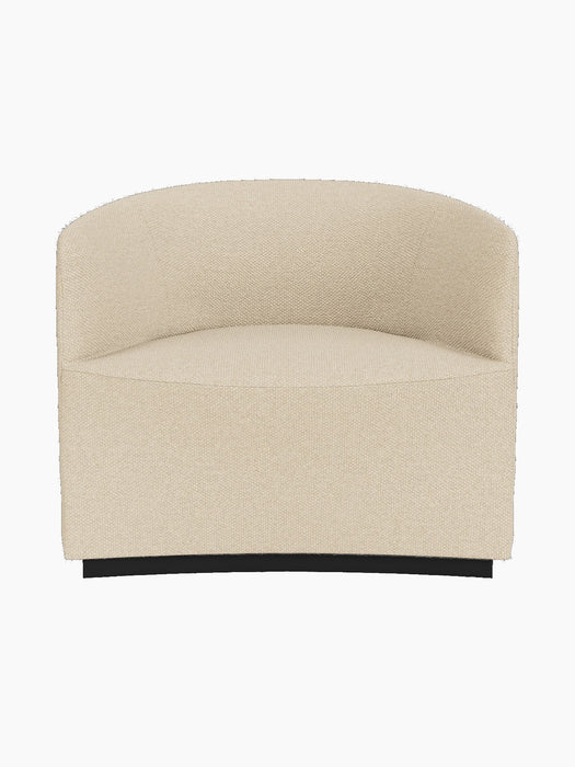 A front-on shot of the sculptural Tearoom Lounge Chair, fully upholstered in a textured, sand-coloured Logan Sand fabric.
