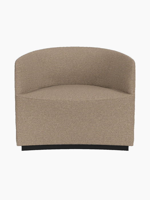 The Tearoom Lounge Chair, upholstered in light brown, textured Logan Flint fabric against a black background.