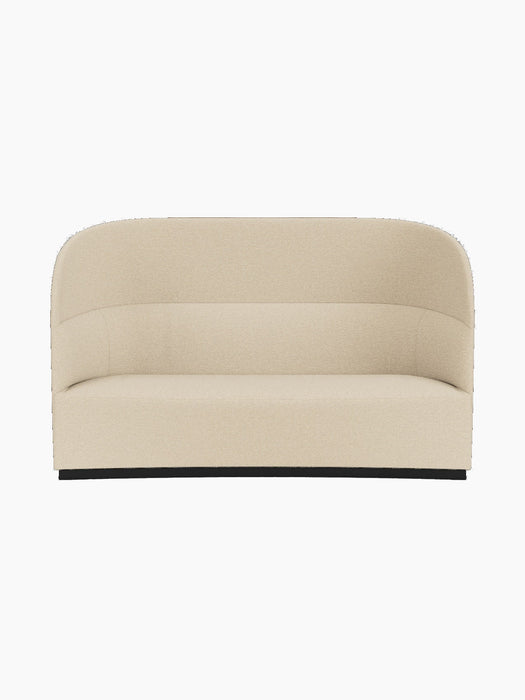Front view of the Tearoom Sofa, High Back in sand Logan upholstery, featuring a high, curved back and a dark plinth base.