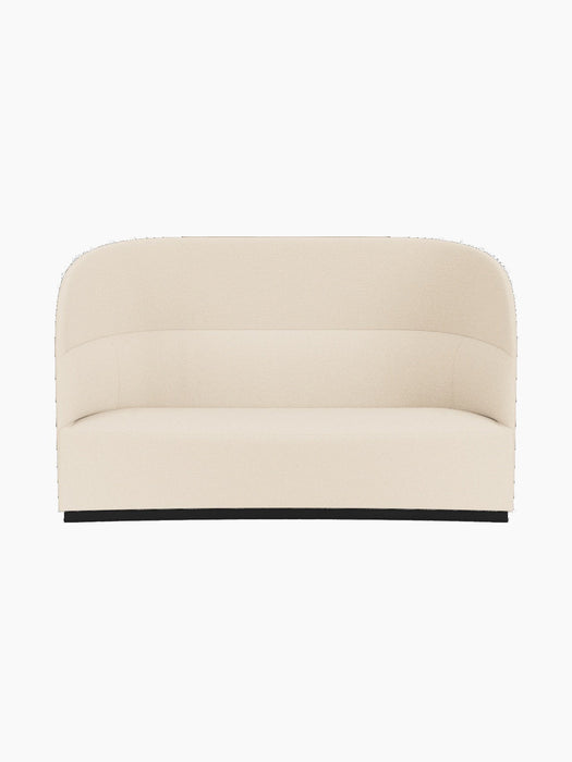 Front view of the Tearoom Sofa, High Back in light Logan Jasmine fabric. It features a high, enveloping back and black base.
