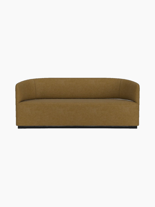 Front view of the Tearoom Sofa, featuring a seamless curved back and upholstered in a golden-brown Audo Bouclé 06 fabric