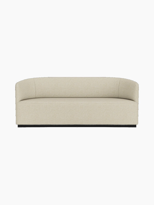 A front-on view of the Tearoom Sofa upholstered in a light beige, textured Savanna 202 fabric against a black background.