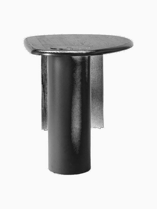 Side view of The Eclipse Desk in black-lacquered oak, showing its asymmetrical tabletop and thick cylindrical steel leg.