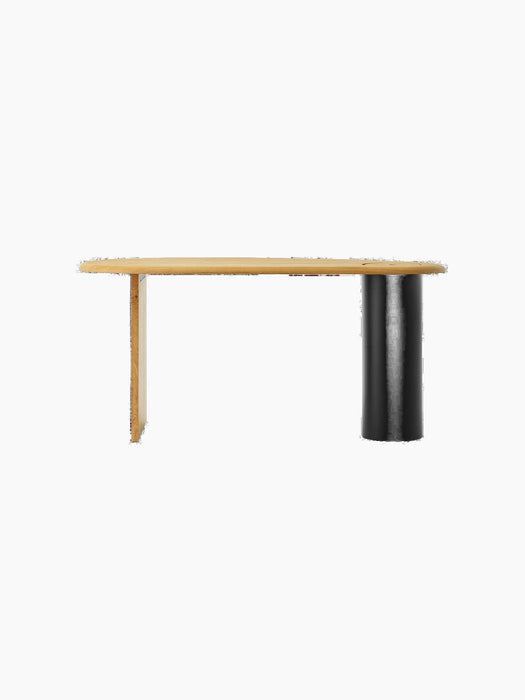 Front view of The Eclipse Desk in natural oiled oak. Asymmetrical top, flat oak leg, and a black cylindrical column leg.