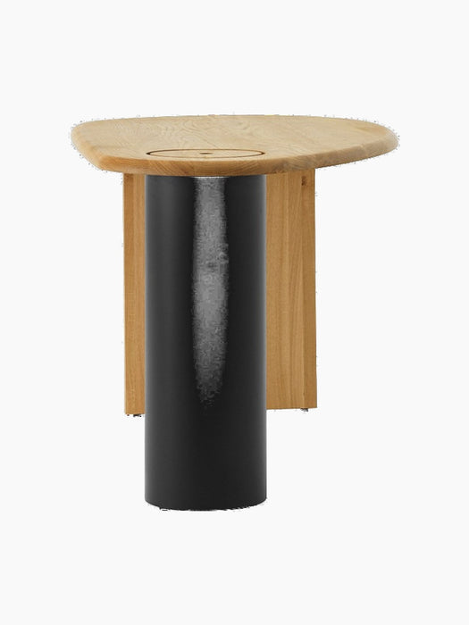 Side profile of The Eclipse Desk in natural oiled oak, detailing the curved tabletop and large, black cylindrical leg.